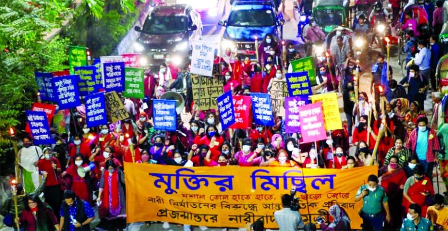 Women's rights activists bring out a procession in the capitalâ€™s Dhanmondi area on Wednesday evening, marking the International Day for the Elimination of Violence against Women.