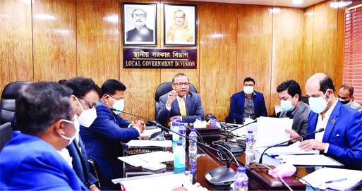 LGRD and Cooperatives Minister Tajul Islam presides over a meeting on handing over responsibility to sewer rain water to DNCC and DSCC from Dhaka WASA at the conference room of LGD on Thursday with a view to eradicating water logging from Dhaka city.