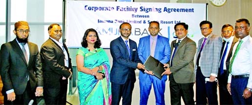 Adnan Mahmud Ashraf-uz-zaman, Head of Cards of Jamuna Bank Limited and Ahmad Raquib, General Manager of Sarah Resort Limited (a concern of Fortis Group), exchanging an agreement signing document at the banks head office in the city recently. Under the dea