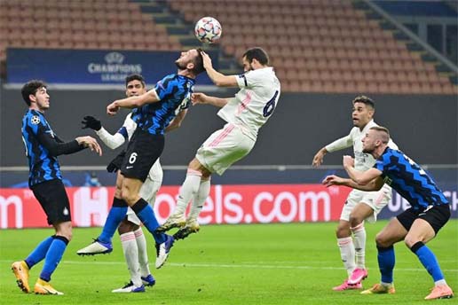 Real Madrid's defender Nacho Fernandez (top right) and Inter Milan's Stefan de Vrij go for a header during the UEFA Champions League, Group B football match on Wednesday.