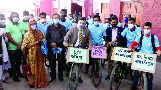 Barishal DC S.M. Ajior Rahman inaugurates a cycle rally at Ashwini Kumar Hall in the town yesterday to make people in conscious for preventing 2nd wave of Covid-19. Prof. Dr. Md. Abdul Aziz, MP inaugurates Tarash Asrayan Project II in Sirajganj on markin