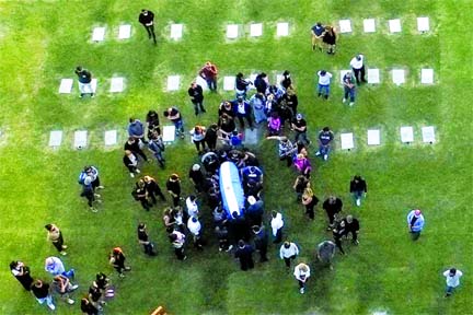 Aerial view of the burrial of late Argentine football legend Diego Armando Maradona as his family and friends carry the coffin with his remains at the Jardin Bella Vista cemetery in Buenos Aires province on Thursday.