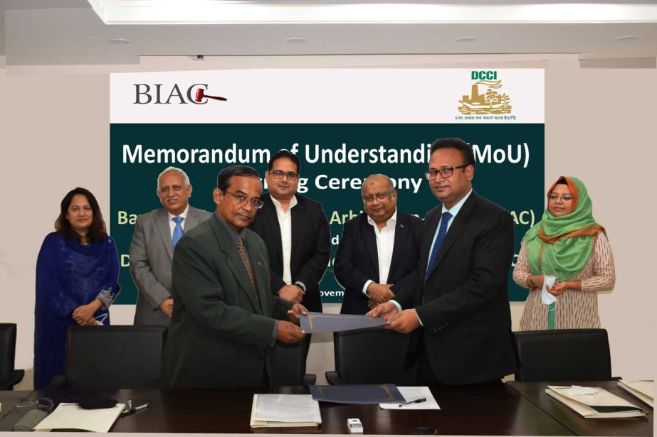 M A Akmall Hossain Azad, Director of Bangladesh International Arbitration Centre (BIAC) and Afsarul Arifeen, Acting Secretary General of DCCI, exchanging documents after signing a Memorandum of Understanding (MoU) at the BIAC secretariat in the city on Th