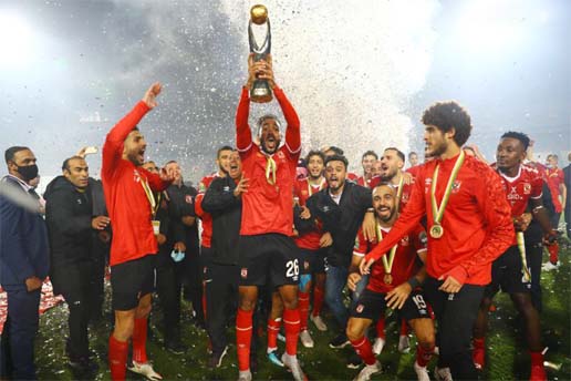 Members of Egypt's Al-Ahly celebrate during the trophy ceremony after the final match of the CAF Champions League in Cairo, Egypt on Friday.