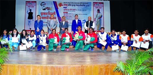 President of Bangladesh Swimming Federation and Chief of Naval Staff Admiral M Shaheen Iqbal with the winners in the Bangabandhu 17th National Long Distance Swimming Competition pose for a photo session at the Sheikh Moni Auditorium in Gopalganj on Saturd