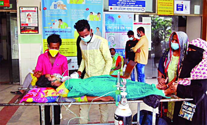 The patients suffering from cold-related diseases are not getting scope to get admitted to hospitals without Covid-19 test result, for which they have to go to different health facilities amid sufferings. The photo was taken from Dhaka Medical College Hos