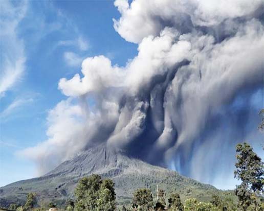 A volcano in eastern Indonesia erupted Sunday, sending a column of ash as high as 4,000 meters (13,120 feet) into the sky and prompting the evacuation of thousands of people.
