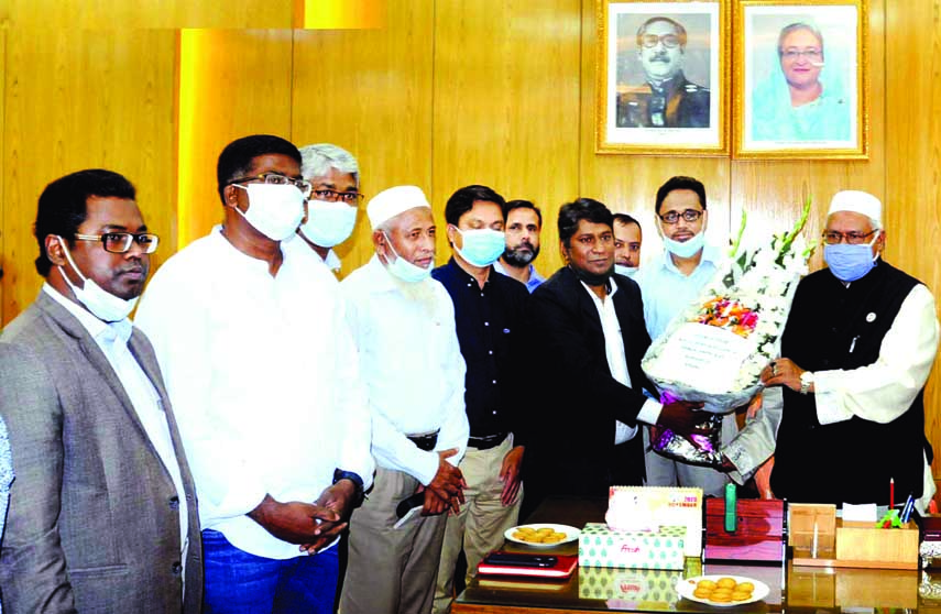 Religious Reporters Forum greets newly appointed State Minister for Religion Faridul Haque Khan giving bouquet at his office room of the ministry on Tuesday.