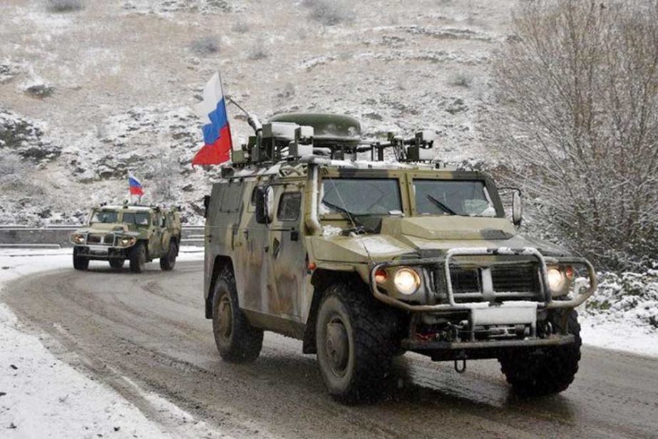 Military vehicles of the Russian peacekeeping force move on the road outside Lachin after six weeks of fighting between Armenia and Azerbaijan over the disputed Nagorno-Karabakh region.