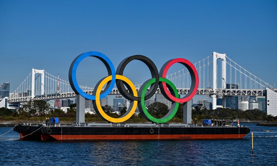 The Olympic rings are reinstalled at the waterfront in Tokyo, Japan on Tuesday, with officials hoping the symbol will help build enthusiasm for the coronavirus-postponed Games.