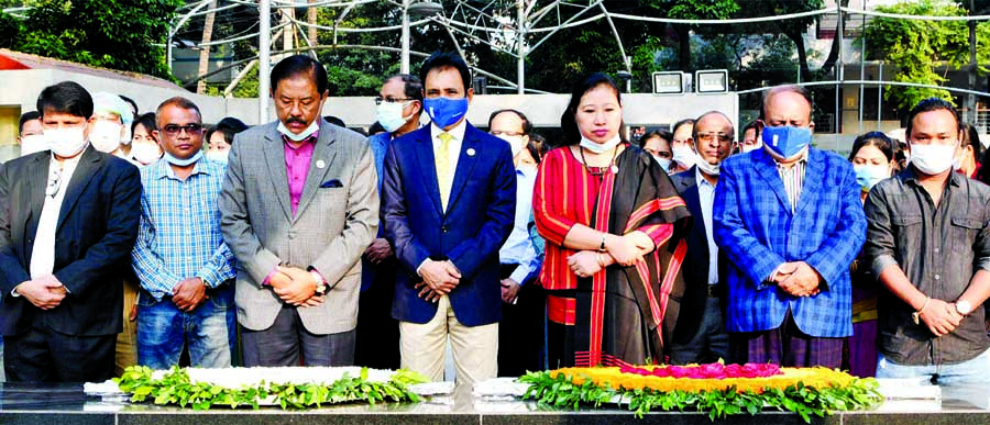 CHT Affairs Minister Bir Bahadur Ushwe Sing along with others stands in solemn silence after placing floral wreaths at the portrait of Father of the Nation Bangabandhu Sheikh Mujibur Rahman in the city's 32, Dhanmondi on Wednesday marking 23rd anniversar