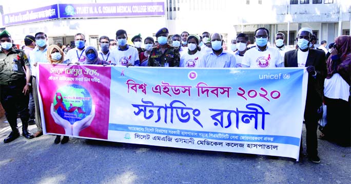 Officials and employees of Sylhet MAG Osmani Medical College Hospital bring out rally on Tuesday marking the World AIDS Day-2020.