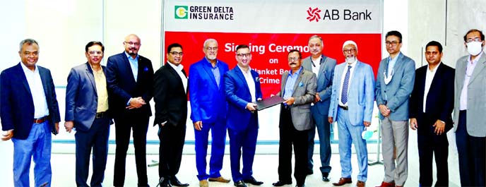 Sajjad Hussain, Additional Managing Director of AB Bank Limited and Syed Moinuddin Ahmed, Additional Managing Director & Company Secretary of Green Delta Insurance Company Limited, exchanging documents after signing an agreement at the bank's head office