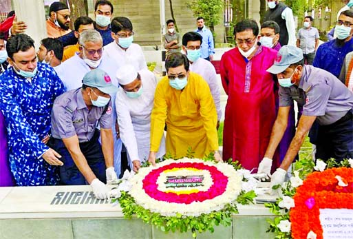DSCC Mayor Barrister Sheikh Fazle Noor Taposh along with others pays floral tributes at the grave of founding Chairman of Juba League Sheikh Fazlul Haque Moni at Banani Graveyard in the city on Friday marking the latter's 81st birthday.