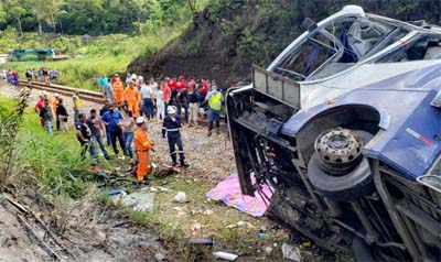 Handout picture released by the Minas Gerais Fire Department showing a bus that fell from a bridge in Joao Monlevade, Brazil on Friday.