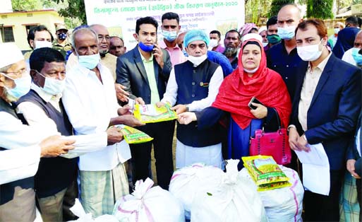 Fatikchhari Upazila Chairman Hossain Mohammad Abu Tayab along with UNO Syedul Arefin distribute Boro Paddy Seed among local farmers at a ceremony organized by Upazila Agriculture Office on Thursday.