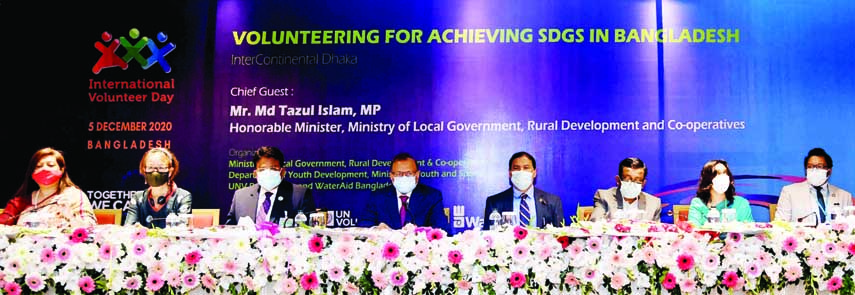 LGRD and Cooperatives Minister Tazul Islam speaks at a seminar at Hotel Inter continental in the city on Saturday marking International Volunteers Day-2020.