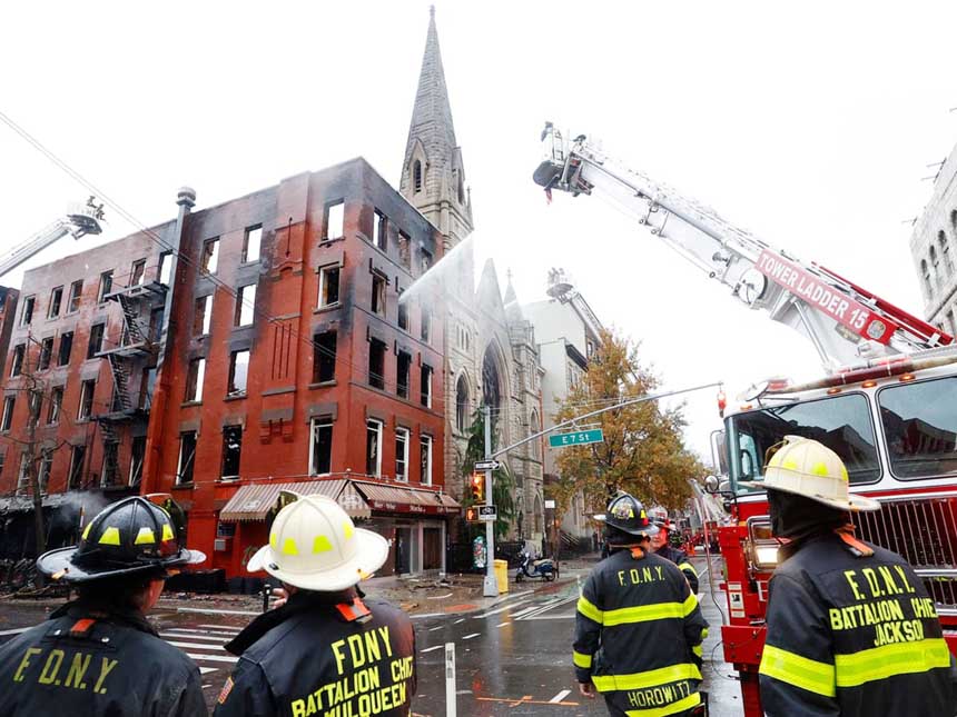 Firefighter work to extinguish the fire at Middle Collegiate Church in New York on Saturday.