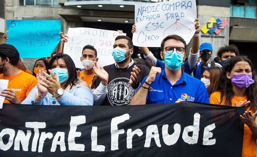 Opposition activist stage a protest, calling to boycott the upcoming parliamentary elections, in front of the National Electoral Council (CNE) headquarters in Caracas.