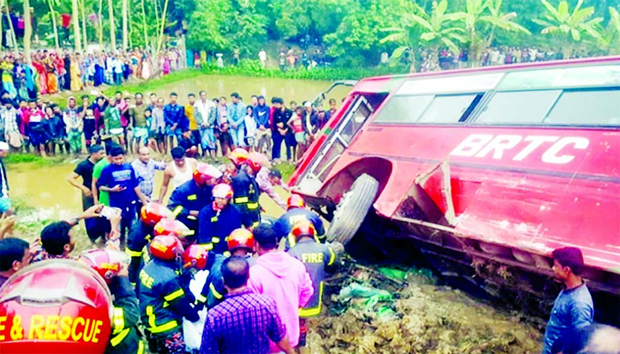 Rescuers of Fire Service and Civil Defence work at the accident spot on the Dhaka-Sylhet Highway at Fultoli area in Nabiganj Upazila of Habiganj district on Monday.