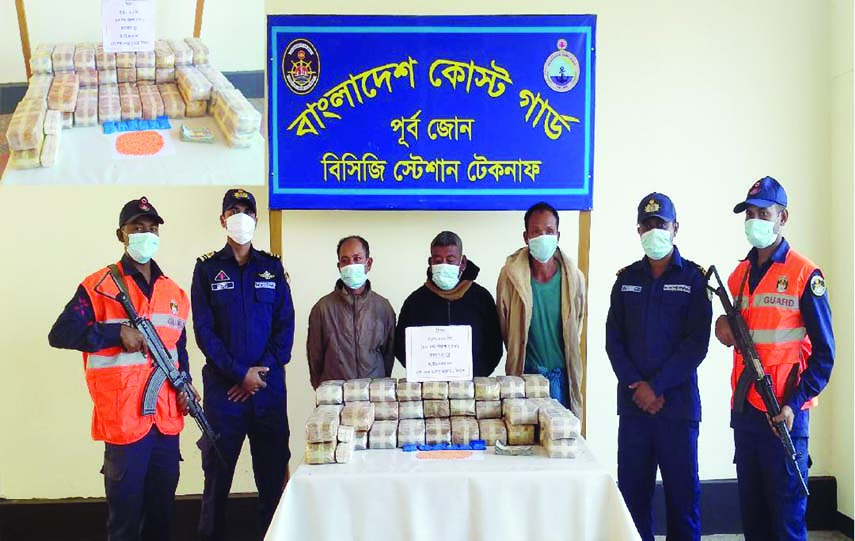 Coast Guard personnel bring the three Myanmar nationals, who were held with Yaba tablets and Myanmar currency, before the media on Monday.