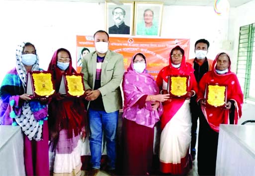 Morelganj (Bagerhat) Upazila Vice Charman Mozzammel Haque Mozam distributes prize among women for their notable contributions to social development during a programe at the upazila parishad conference room on Wednesday morning