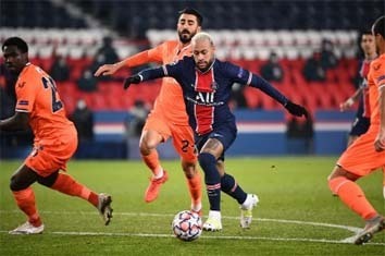 PSG's forward Neymar (center) is challenged by Istanbul Basaksehir's midfielder Mahmut Tekdemir (back) during the UEFA Champions League, group H football match at the Parc des Princes stadium in Paris on Wednesday.