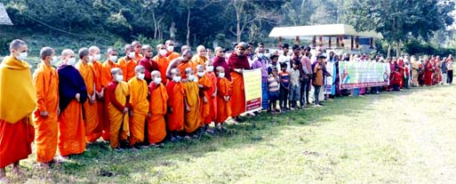 Bangladesh Socheton Buddho Jonosadharon forms a human chain demanding power connection at Ganshoron Moharonno Buddho Bihar DS Primary School in Rangunia upazila, Chattogram on Sunday.