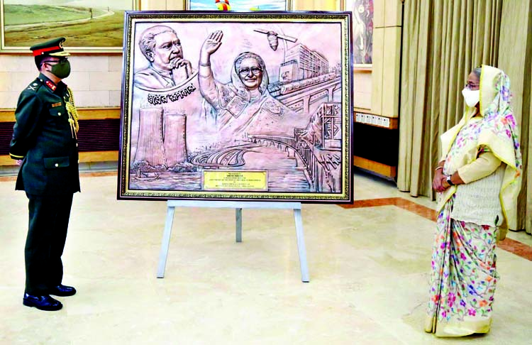 Prime Minister Sheikh Hasina has been given a painting named 'Sopner Rupokar' on behalf of National Defence College at Ganobhaban. PID photo