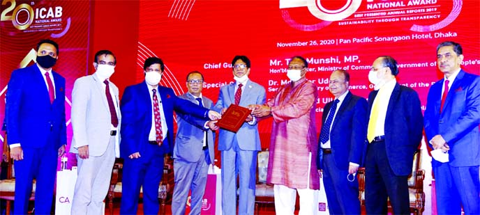 Khondoker Rashed Maqsood, Managing Director of the Standard Bank Limited, receiving ICAB National Award for Best Presented Annual Reports 2019 from the Commerce Minister Tipu Munshi at Hotel Pan Pacific Sonargaon in the capital recently. Bank's Chief Fin