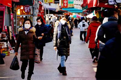 People shop amid the coronavirus disease (COVID-19) pandemic at a traditional market in Seoul, South Korea.