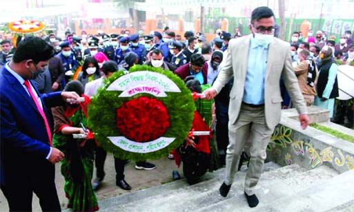 Shariatpur DC Parvez Hasan along with senior officials of the district administration place wreaths at the central Shaheed Minar on Wednesday marking the 50th Victory Day.