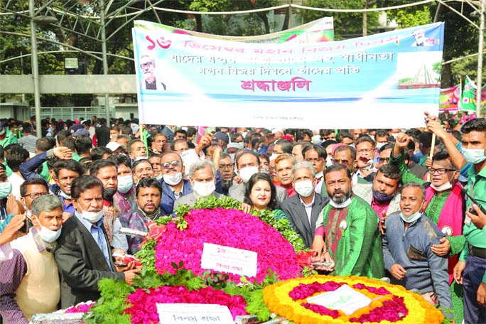 Md Abdus Salam, Managing Director of Janata Bank Ltd, along with the employees paying tribute by placing wreaths at the portrait of the Father of the Nation Bangabandhu Sheikh Mujibur Rahman at Dhanmondi 32 in the city on Wednesday marking the Victory Day