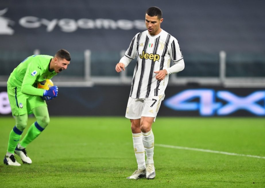 Juventus' Cristiano Ronaldo (right) reacts after missing a penalty against Atalanta on Wednesday.