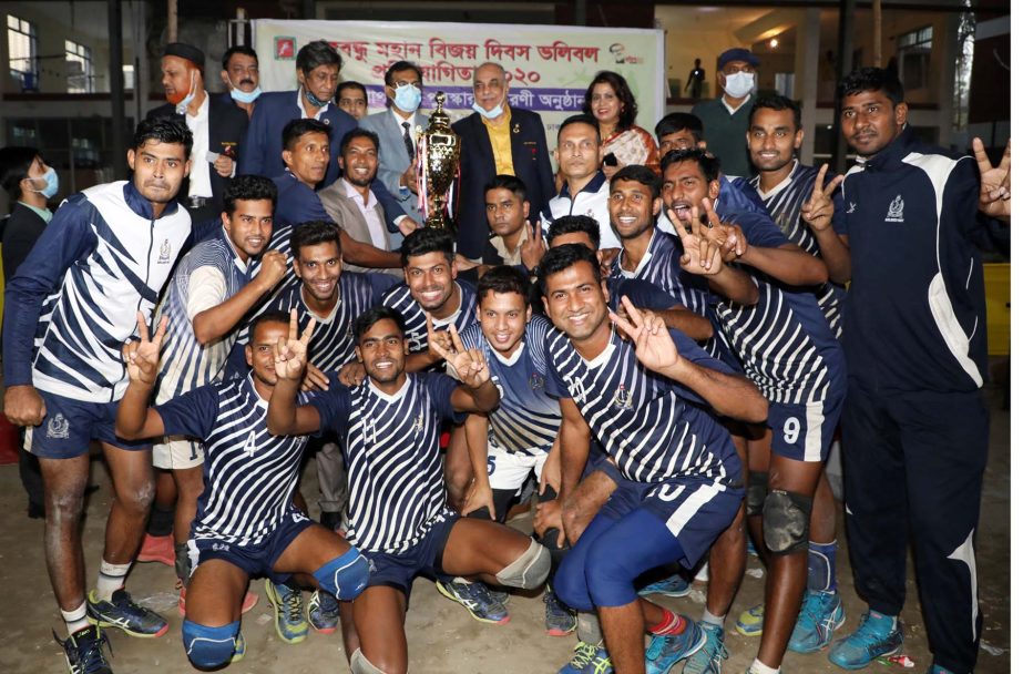 Bangladesh Navy, the champions in the Bangabandhu Victory Day Volleyball Competition with the chief guest Secretary of the Ministry of Information Khaja Miah and the officials of Bangladesh Volleyball Federation pose for a photo session at the Shaheed Noo