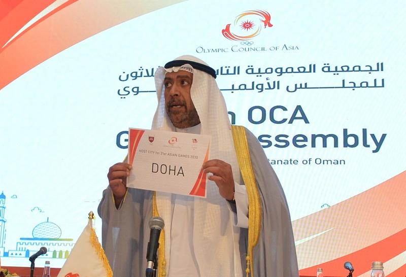 President of the Olympic Council of Asia (OCA) Ahmad al-Fahad al-Sabah holds a placard announcing Doha as the host of the 21st Asian Games 2030 during the 39th OCA General Assembly Meeting, in Muscat, capital of Oman on Wednesday.
