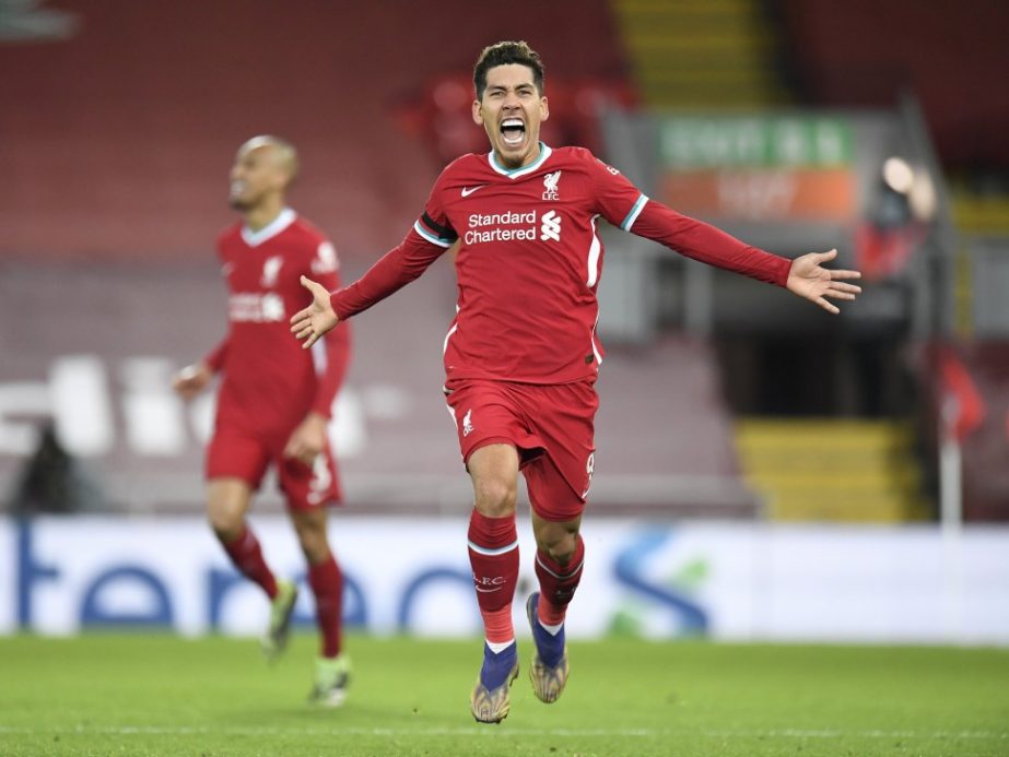 Liverpool's Roberto Firmino celebrates after scoring his side's 2nd goal during their English Premier League soccer match against Tottenham Hotspur at Anfield in Liverpool, England on Wednesday.