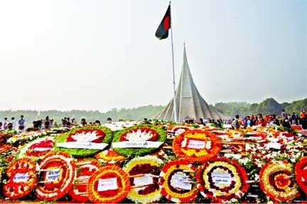 People pay homage to the martyrs of the Liberation War at the National Mausoleum in Savar, on the outskirts of capital Dhaka, marking the 50th Victory Day on Wednesday.