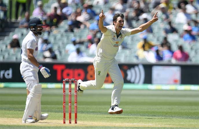Australian bowler Pat Cummins (right) reacts after dismissing an Indian wicket on day 3 of the first Test match between Australia and India at the Adelaide Oval in Adelaide, Australia on Saturday.
