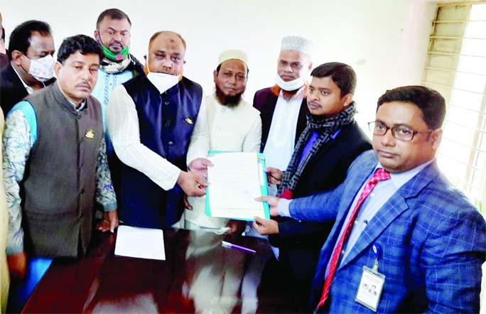 Awami League's Golam Kibria submits his nomination form to participate in the Fulbaria (Mymensingh) Municipally polls to district Election officer Md Shafiqul Islam yesterday.