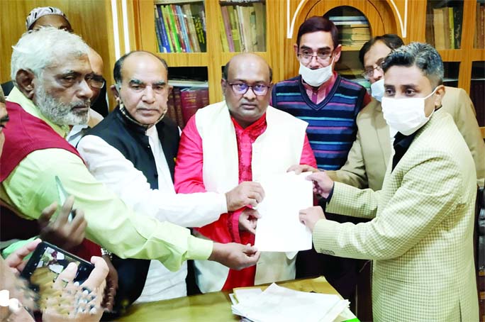 Awami League's Mayoral candidate Golam Hasnain Rashel submits his nomination paper to participate in the Bhangura (Pabna) Municipality Election to the Returning officer on Sunday.
