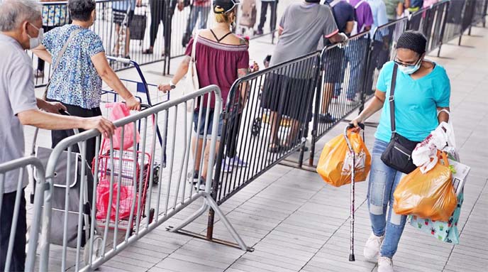 In Brooklyn, Americans waited for food last week outside the Barclays Center, a distribution point for the Food Bank for New York City, US.