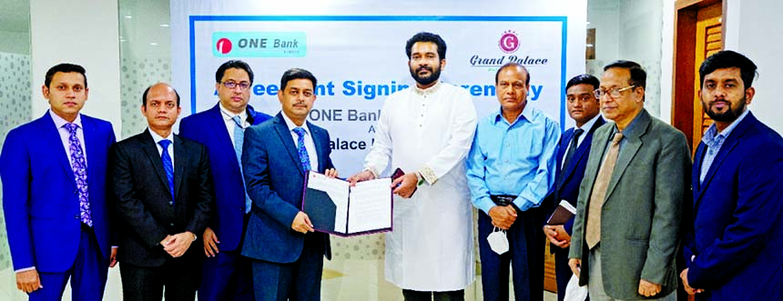 Md. Kamruzzaman, Head of Retail Banking of ONE Bank Limited (OBL) and Salahuddin Ahmed, Chairman and Managing Director of Grand Palace Hotel & Resorts Limited, exchanging an agreement signing document at the banks head office in the city recently. Under t