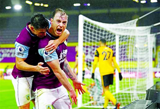 Burnley's Ashley Barnes (centre) celebrates with teammates after scoring his side's opening goal during the English Premier League soccer match between Burnley and Wolverhampton Wanderers at the Turf Moor stadium in Burnley, England on Monday.