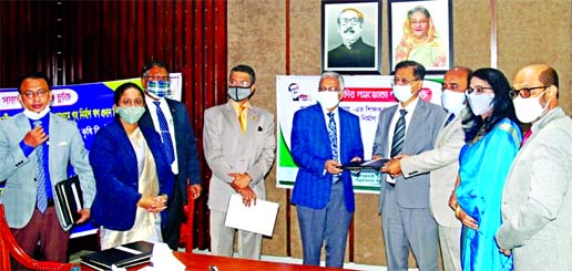 Md Afzal Karim, Deputy Managing Director of Sonali Bank Limited, Professor Dr. Md Nzarul Islam, Treasurer of Sher-e Bangla Agricultural University and Ekhlasur Rahman, Additional Secretary of Finance division, exchanging a tri-party MoU signing document t