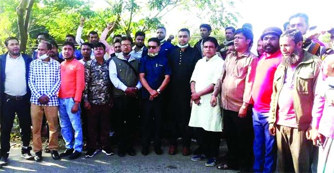 Zakaria Ahmed, President of Sylhet District CNG Auto Rickshaw Workers' Union speaks at a rally on Dhaka-Sylhet Highway on Tuesday.