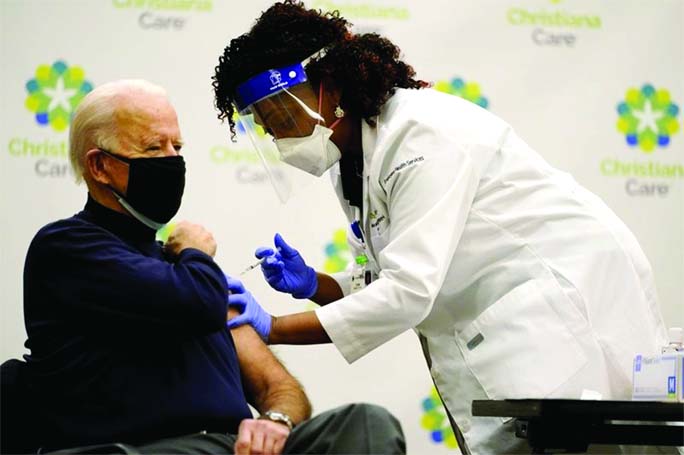 President-elect Joe Biden receives his first dose of the coronavirus vaccine at Christiana Hospital in Newark, Del., on Monday.