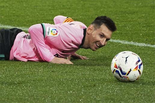 Barcelona's Lionel Messi lies on the ground during a Spanish La Liga soccer match between Valladolid and Barcelona at the Jose Zorrilla stadium in Valladolid, Spain on Tuesday.