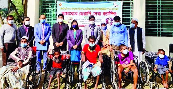 Chandpur's Hajiganj Upazila UNO Boishakhi Barua distributes wheelchairs among 10 physically challenged people at a simple ceremony held on the Upazila Parishad premises in the district on Monday afternoon.