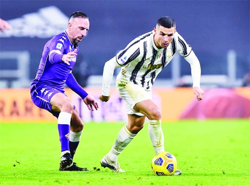 Juventus' Cristiano Ronaldo (right) in action with Fiorentina's Franck Ribery during the Serie A match at Allianz Stadium, Turin, Italy on Tuesday.